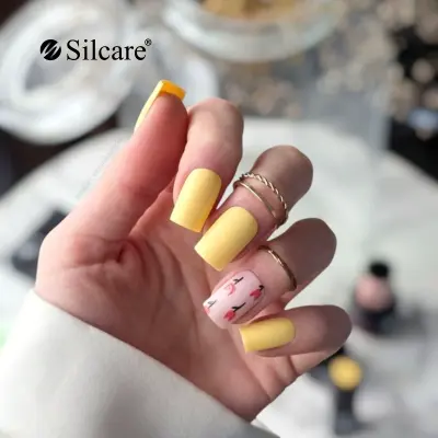 Matte yellow nails with tulip accent