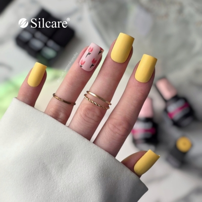 Matowe żółte paznokcie z tulipanowym akcentem Matowe żółte paznokcie z tulipanowym akcentem