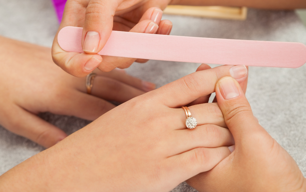 preparing nails with a file