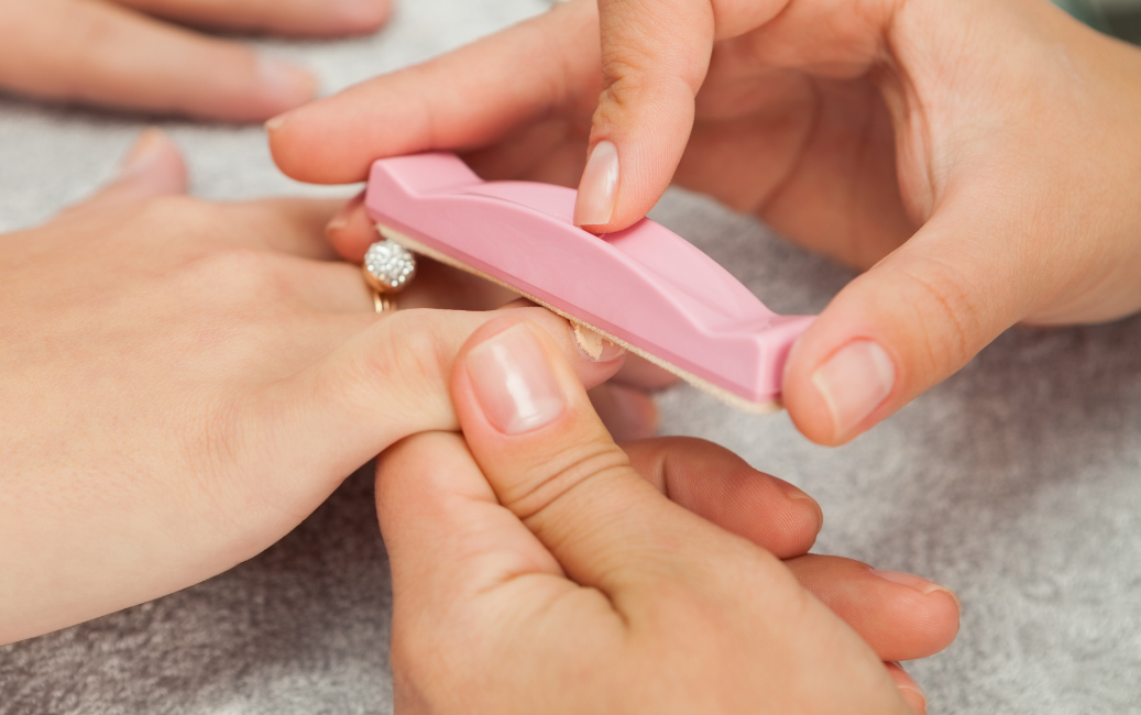 rubbing paste into the nail plate