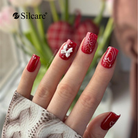 Red manicure with a bow - a charming design for special occasions