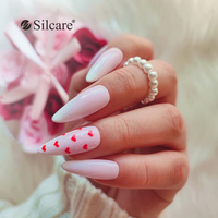 Subtle white hybrid nails with red hearts