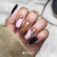 Gold and black - luxurious decorations on hybrid nails