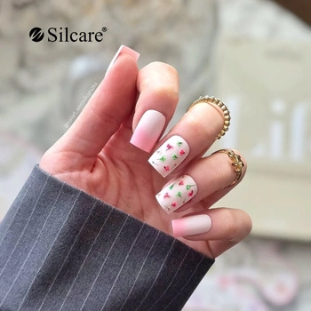 Nude nails with a floral accent - a delicate design