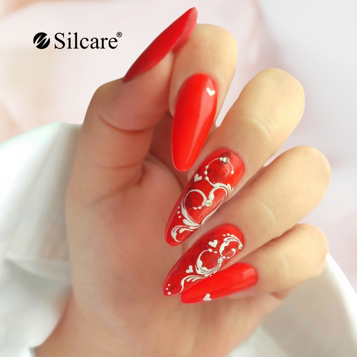 Royal red with ornaments - elegant hybrid manicure