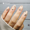 Nail styling in shades of beige and gold