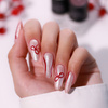 Christmas manicure with a bow - an elegant detail in a winter, gift-inspired style