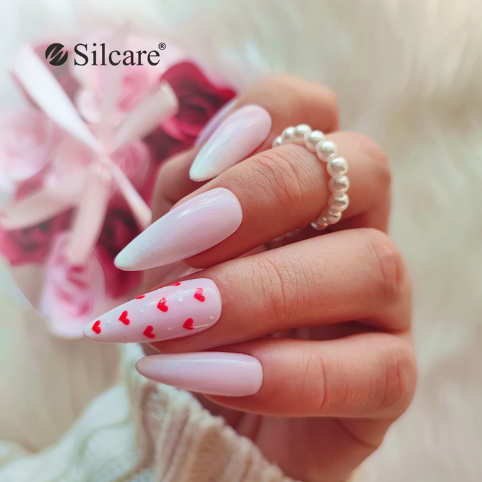 Subtle white hybrid nails with red hearts