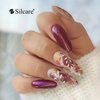 Una nail art ricca di colori caldi