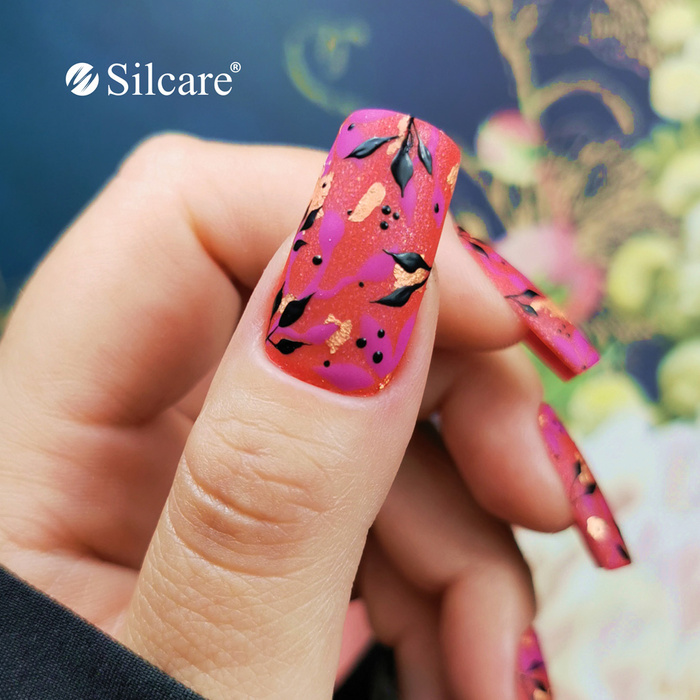 Neon hybrid nails with a leaf effect - a bold summer look