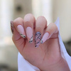 Zebra nails - elegant nude combined with a trendy pattern