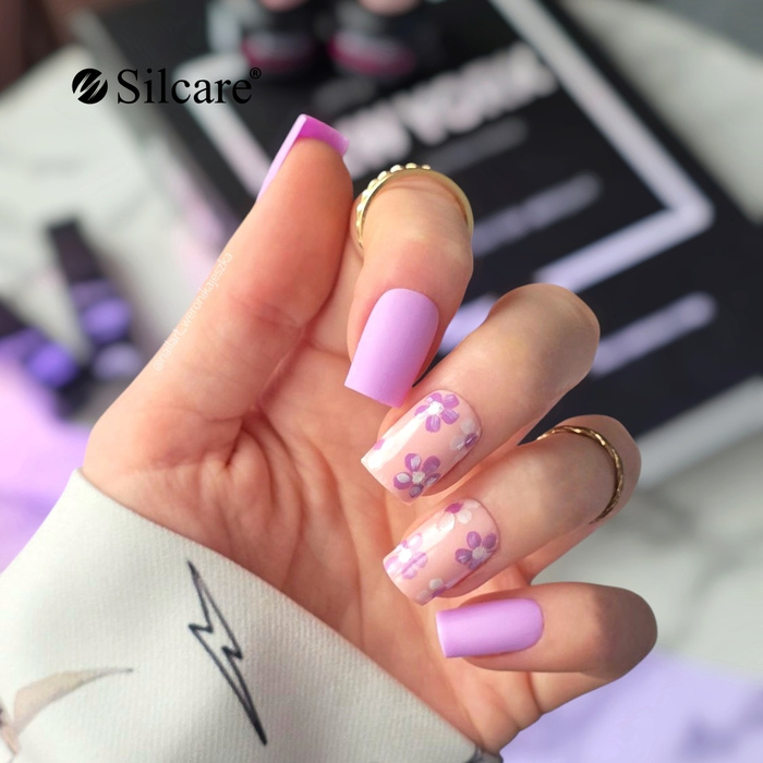 Purple nails with floral decorations