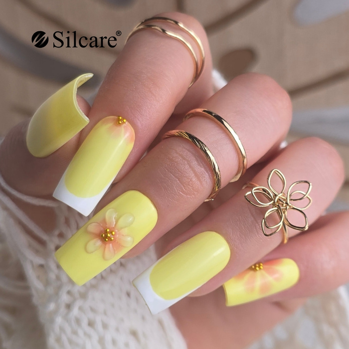 Żółte paznokcie z kwiatowym akcentem