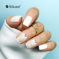 Unghie bianche con effetto conchiglia e strass